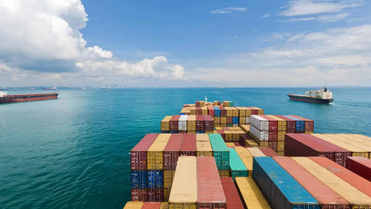 several ships carrying many containers at sea